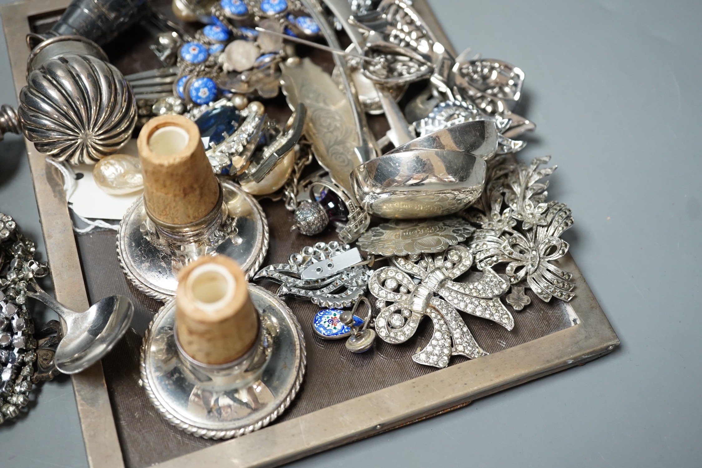 A George V silver mounted rectangular photograph frame, 21.6cm and other items including paste set costume jewellery, silver shell, silver churn condiment, enamelled necklace and earrings, etc.